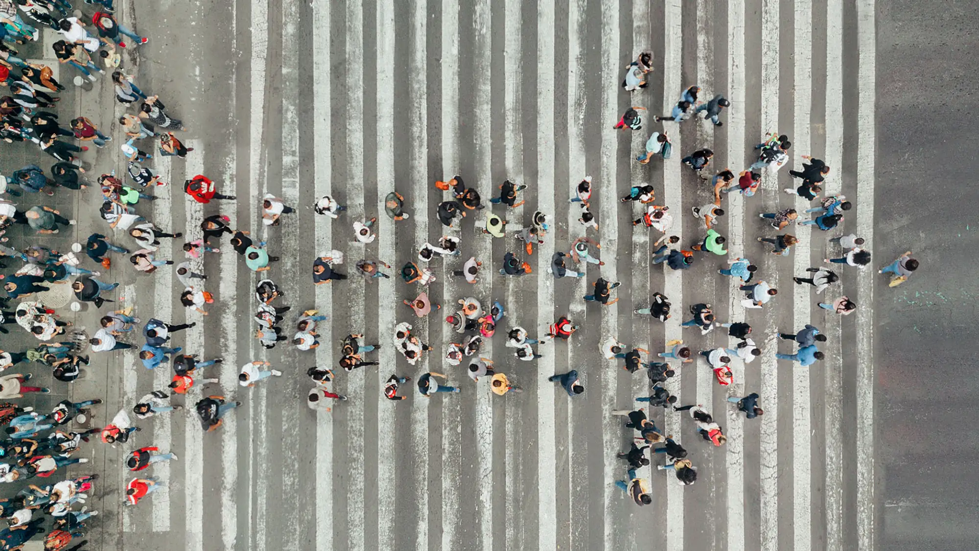 High angle view of people forming an arrow on a street